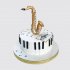 Торт в виде золотого саксофона на клавишах рояля №110254